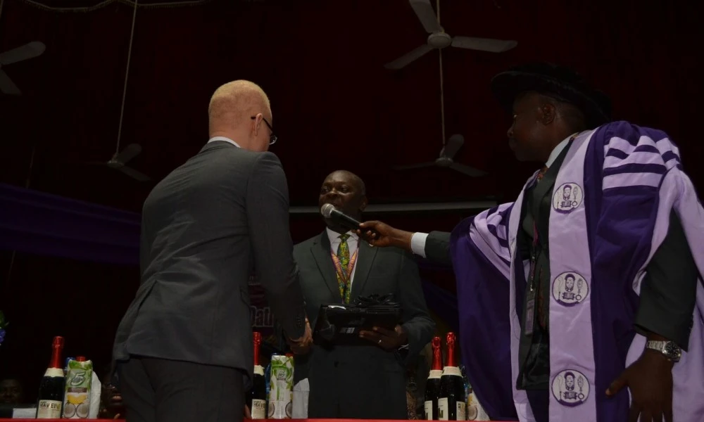 Hafeez Shaka being presented with his new laptop and cash prize from AGHEIF at the University of Benin Medical School Oath-taking Ceremony on 23rd September 2015.
