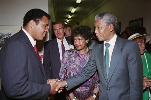 Muhammad Ali and Nelson Mandela meet in 1990 image courtesy of Corbis http://www.bbc.co.uk/timelines/zy3hycw